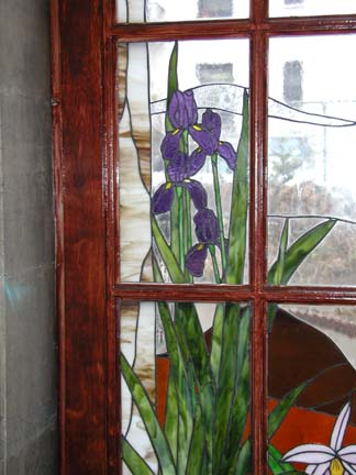 Stained glass scene in residential building lobby doors and transoms